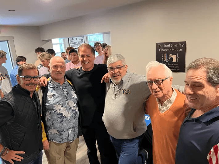 Brothers gathering with Mark Cuban at the Joel Smalley Chapter House, PA Gamma Sigma - Pitt PiLam.